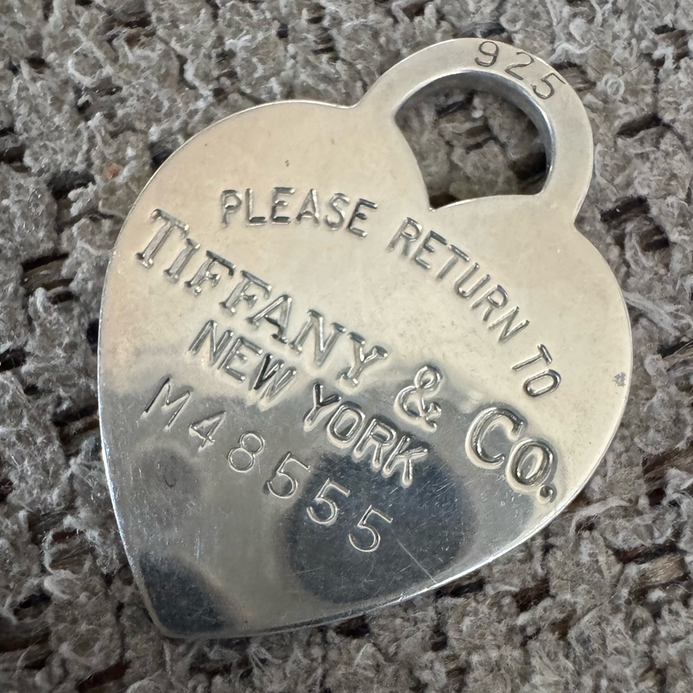 Tiffany & Co heart charm pendant with dust bag. Gently used.